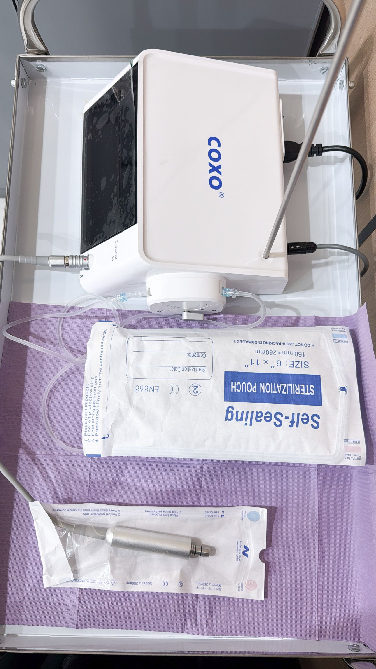 Dental workstation with modern chair and overhead light Denta at Diva